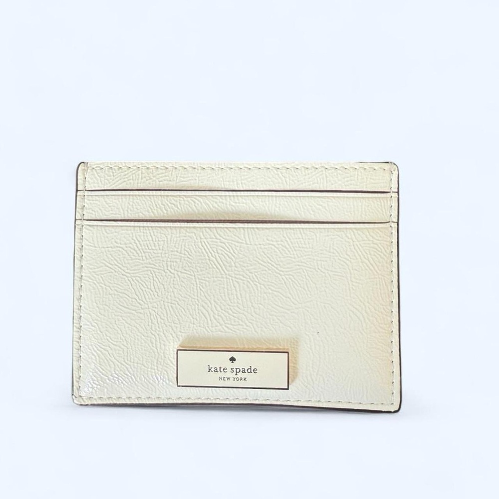 kate spade cream leather slim card case with gold logo